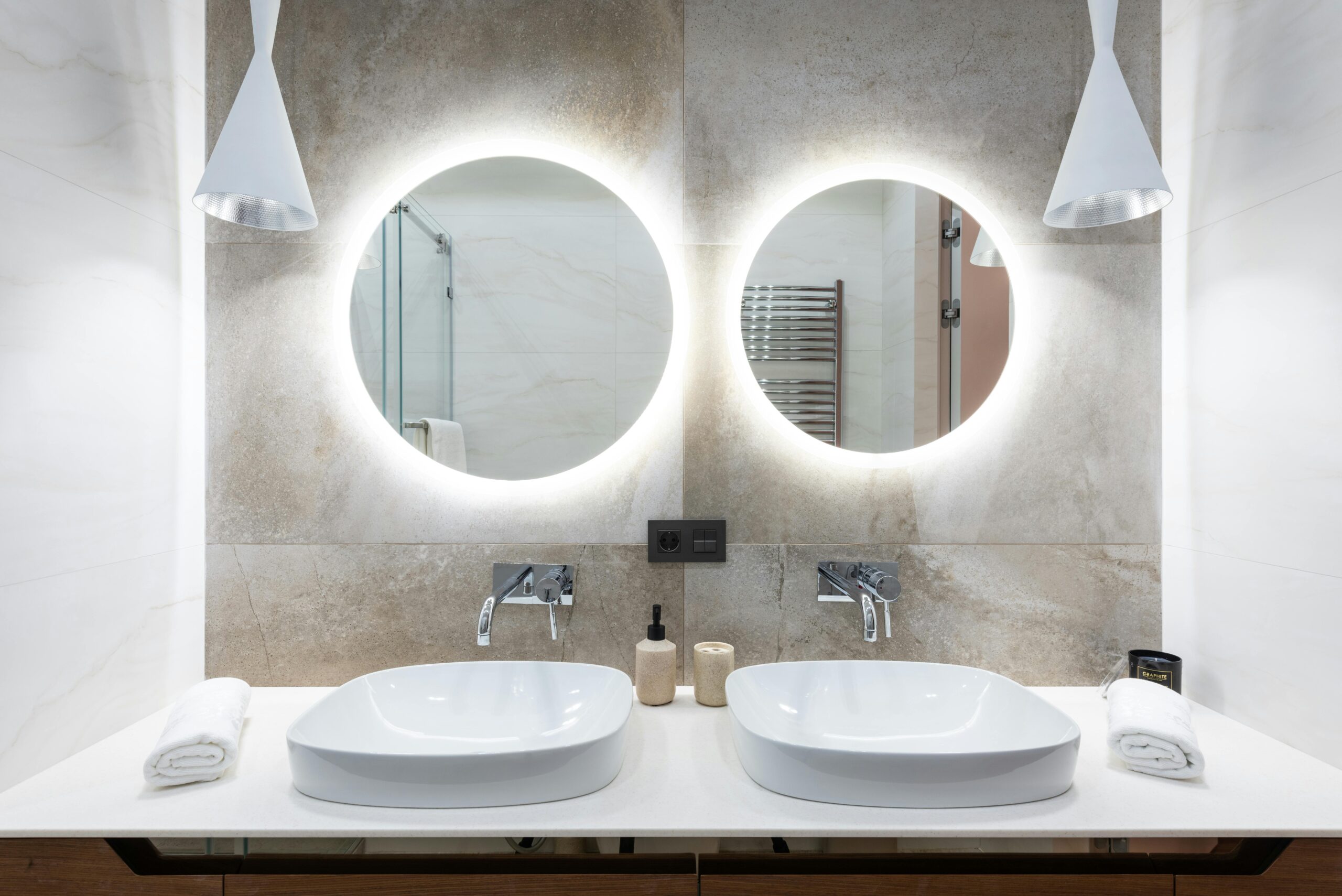 Nice and bright bathroom with two mirrors and two sinks